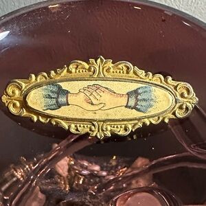 Vintage Gold and Purple Brooch with Handshake Design
